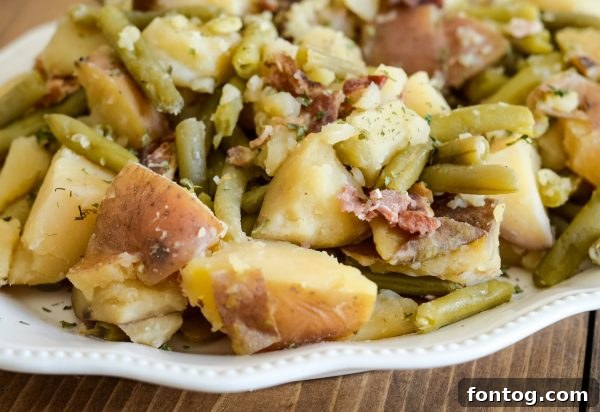 Southern style slow cooker green beans and potatoes with bacon and dill.