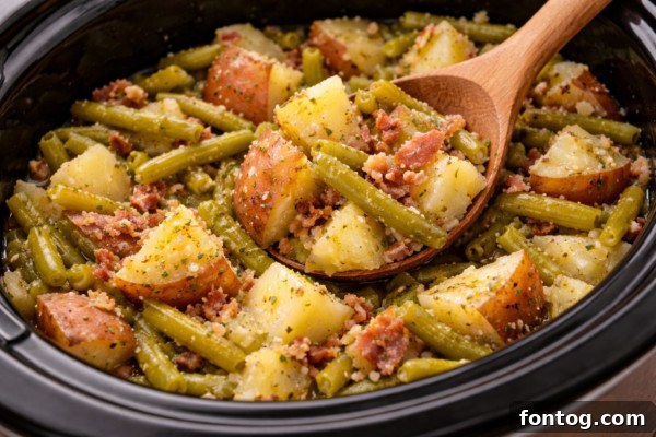 Delicious slow cooker green beans and potatoes ready to serve.