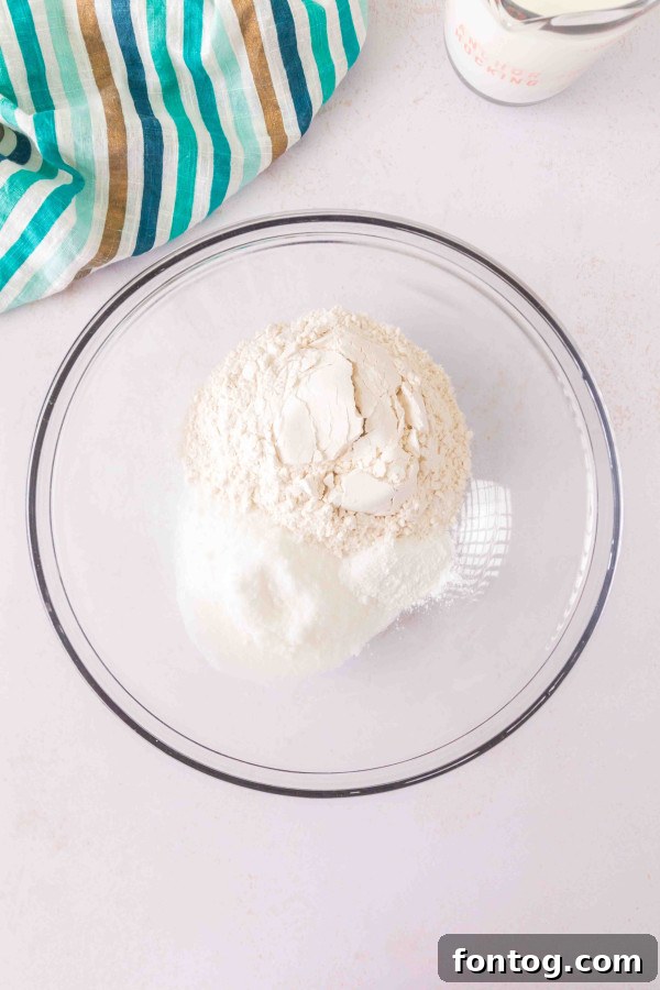 Ingredients for gluten-free blackberry cobbler laid out on a table, including gluten-free flour.