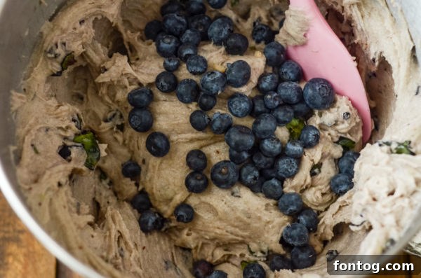 Gluten-free blueberry bread batter with fresh blueberries mixed in