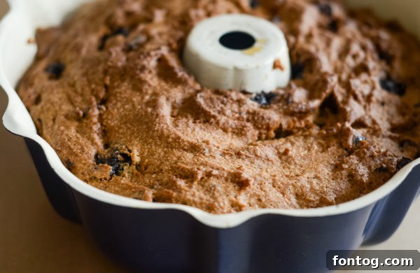 Sliced gluten-free blueberry bread loaf cooling on a wooden board, ready to serve