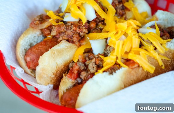 Ground beef cooking in a skillet, finely chopped with a meat chopper