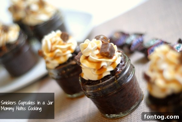 snickers cupcakes in a jar Delicious Snickers cupcakes in a jar, perfect for football season parties