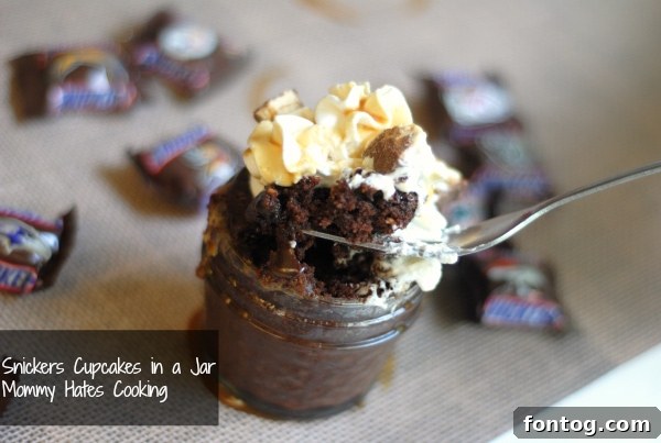 snickers jar cupcakes display Multiple Snickers cupcakes in jars, ready to be served at a party