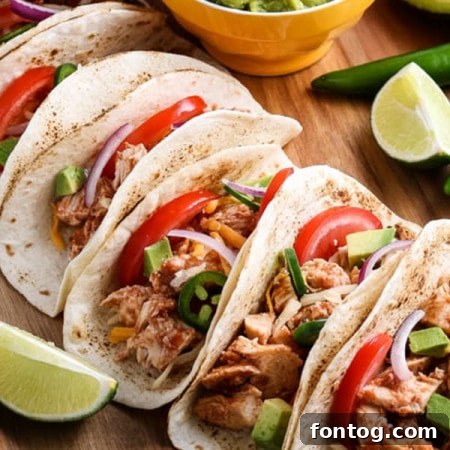 Row of Ninja Foodi chicken tacos.