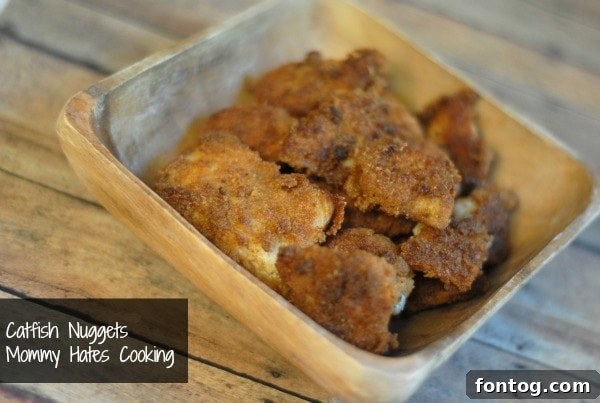 Golden, crispy catfish nuggets served with lemon wedges