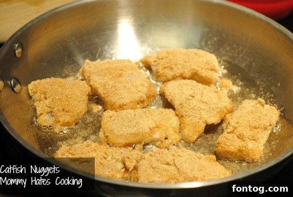 Close-up of golden brown catfish nuggets on a plate