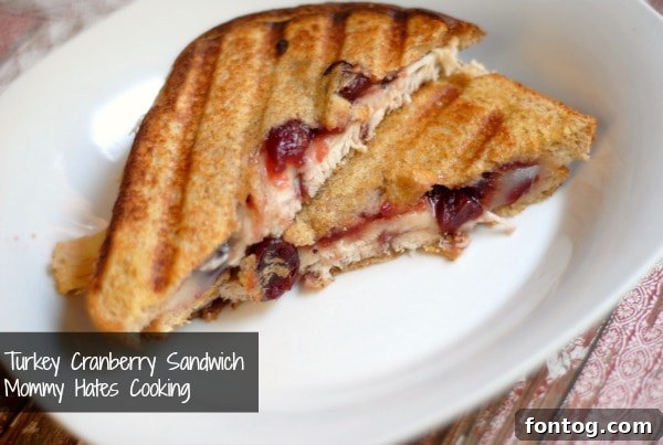 Grilled Turkey Cranberry Sandwich cut in half