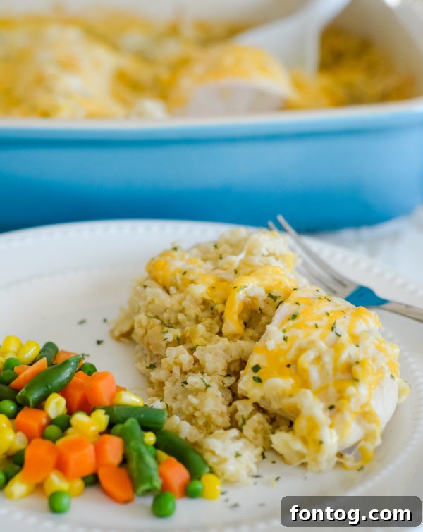 Delicious gluten-free cheesy chicken and rice casserole served in a bowl, ready to eat.