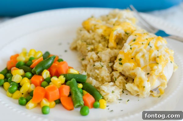 A dish of cheesy chicken and rice casserole, steaming fresh from the oven, ready to be enjoyed.