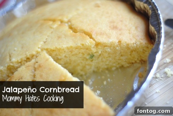 Close-up of baked Jalapeño Cornbread, showing golden crust and pepper pieces