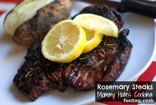 Sizzling grilled rosemary lemon steaks beautifully arranged on a rustic wooden board, garnished with fresh herbs, ready for a spring outdoor meal.