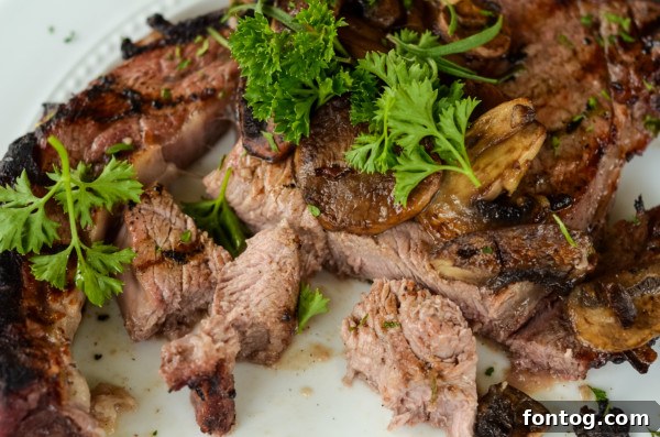 A cooked grilled steak on a cutting board