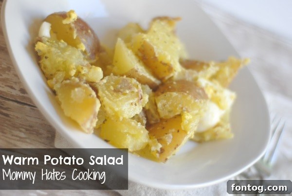 Delicious Warm Potato Salad with fresh ingredients, garnished and ready to serve
