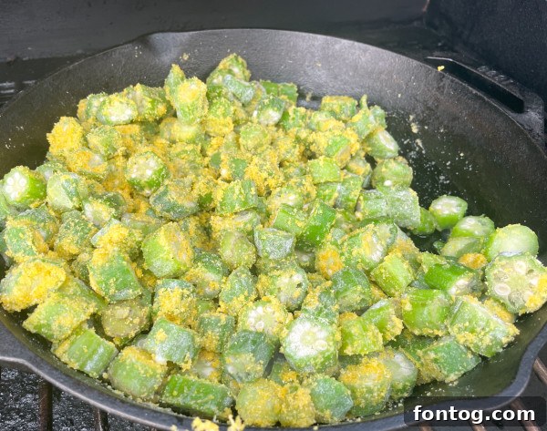 Close-up of grilled okra with onions and cornmeal