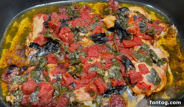ingredients for slow cooker chicken bruschetta being mixed in a bowl