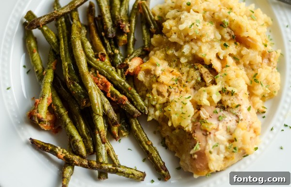 Close-up of a portion of Maple Chicken and Rice Bake, emphasizing the chicken and rice texture.
