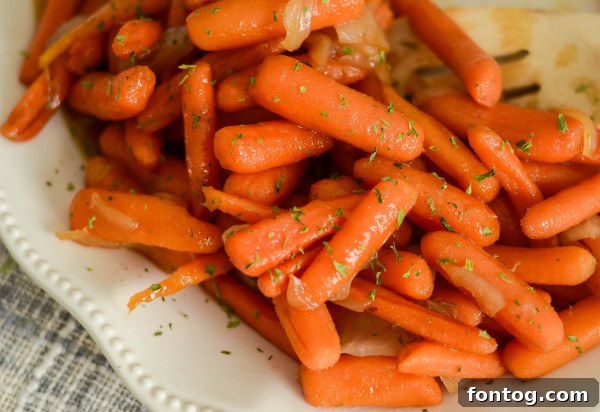 A bowl of baby carrots, ready for preparation into apple cider glazed carrots.