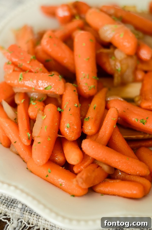 A serving of apple cider glazed carrots, ready to be enjoyed or stored as leftovers.