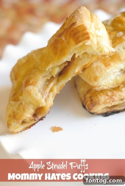 Golden brown apple strudel puffs on a baking sheet, ready to be served