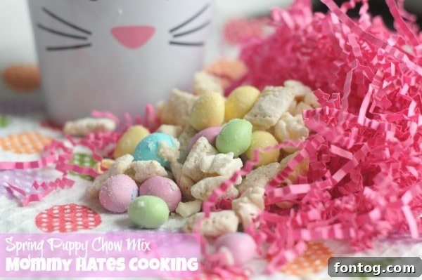 A bowl of delicious Spring Puppy Chow Mix, ready to be enjoyed as a festive snack for gatherings.