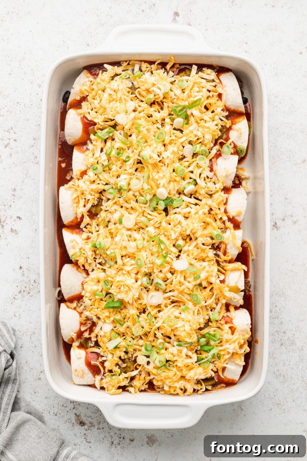 rolling cheesy beef enchiladas