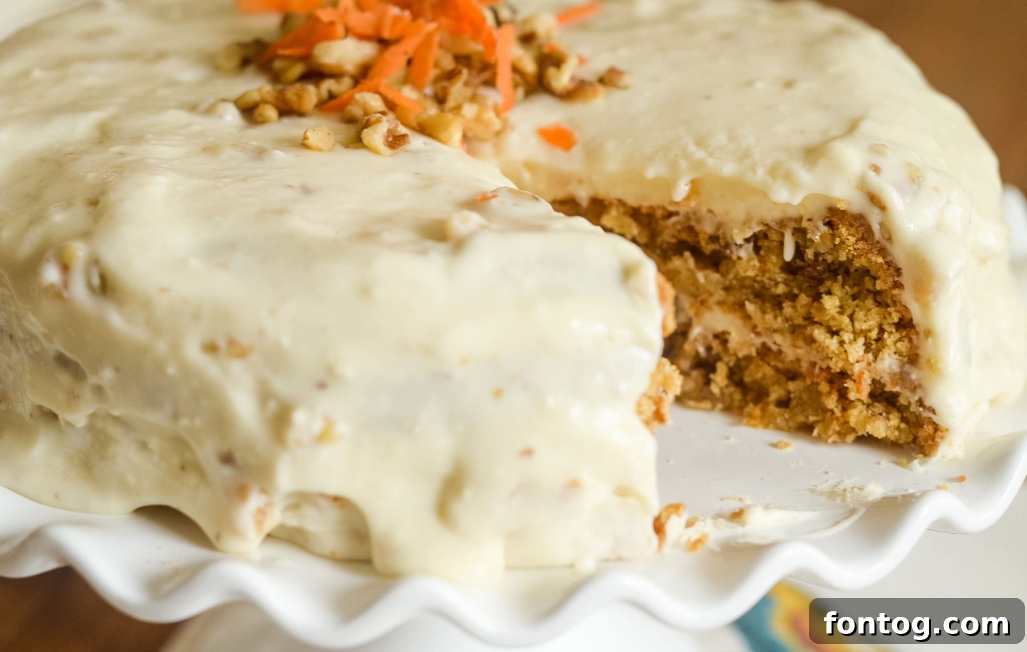 Close-up of a slice of Gluten-Free Carrot Cake with cream cheese frosting