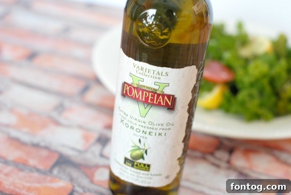 Kale salad with a drizzle of Pompeian olive oil