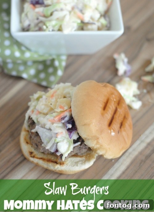 Delicious Slaw Burger served with extra slaw on the side, perfect for a summer cookout