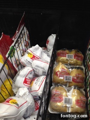 Closeup of Kikkoman Teriyaki Sauce bottle with coupon offer for Tyson Cornish Hens.