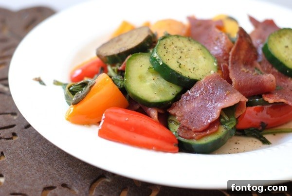 Sautéed vegetables and turkey bacon, ready for a healthy meal.