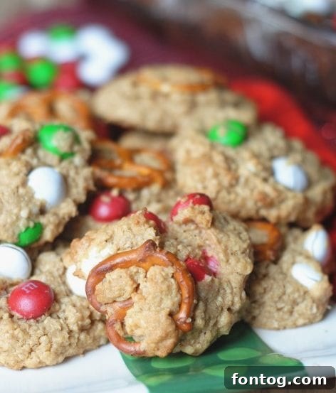 31 Joyful Christmas Cookie Recipes 6 Festive and colorful M&M Christmas cookies, perfectly baked and ready for holiday enjoyment.