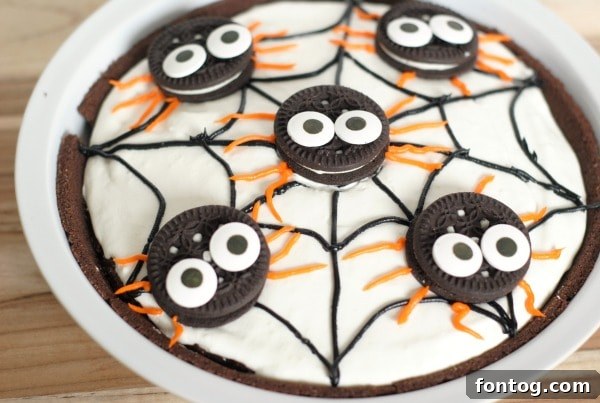 A curated selection of ingredients for the No-Bake Spider Pudding Pie, including instant pudding mix, chocolate cookies, and pie shell