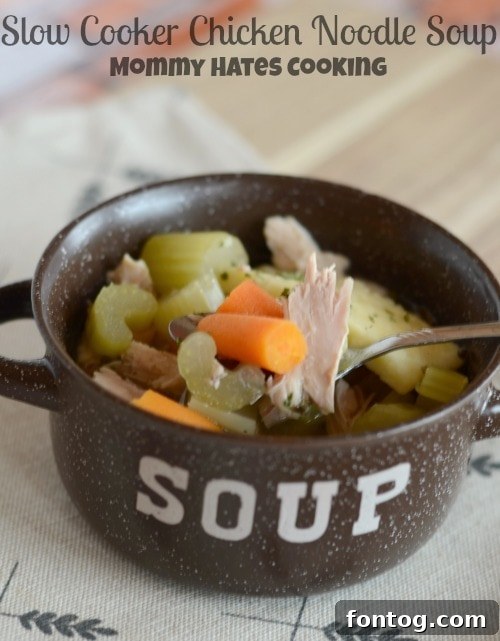 Hearty Slow Cooker Chicken Noodle Soup in a rustic bowl