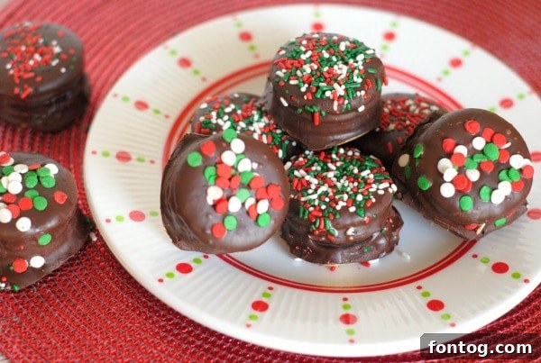 Close-up of Oreo Stuffed Chocolate Covered Ritz Crackers with festive sprinkles