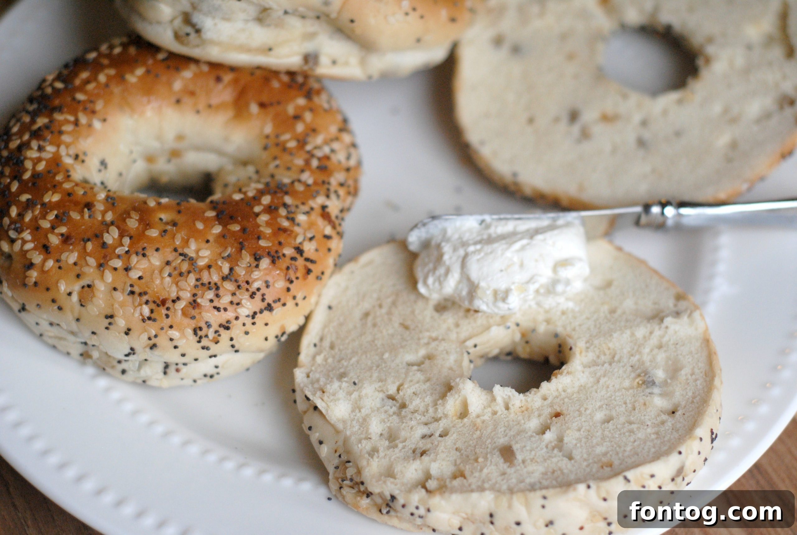 An inviting spread of healthy snacks, featuring various Dean's Dips alongside colorful sliced bell peppers, crisp carrots, crunchy pretzels, and sweet grape tomatoes, designed to appeal to both children and adults for nutritious snacking.