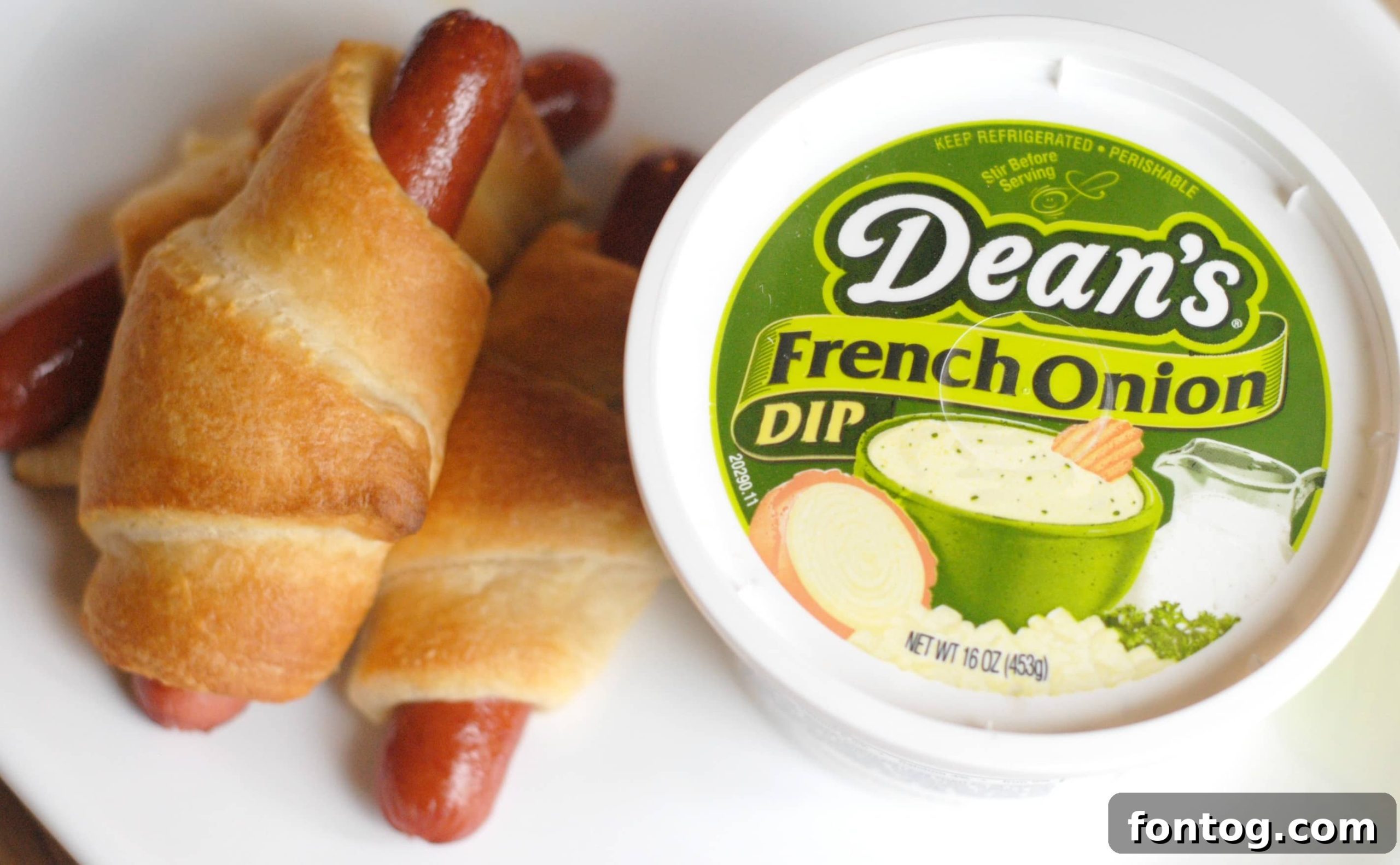 A beautifully arranged spread of various dishes creatively incorporating Dean's Dip, including a gourmet sandwich, vibrant fresh vegetables, and a creamy main course, eloquently demonstrating its versatile application across diverse culinary contexts.