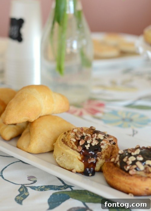 Effortless Party Breakfasts: Berry Orange Smoothies and More 10 A vibrant fruit platter featuring an assortment of colorful berries, grapes, and melon slices, accompanied by a creamy fruit dip, perfect for a refreshing brunch.