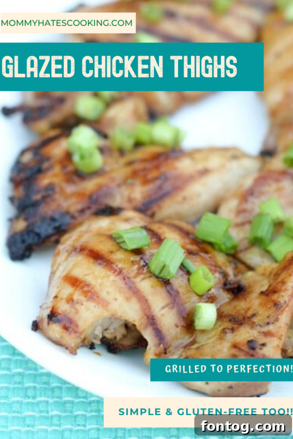 Beautifully glazed chicken thighs on a serving board with fresh herbs, ready to be enjoyed.
