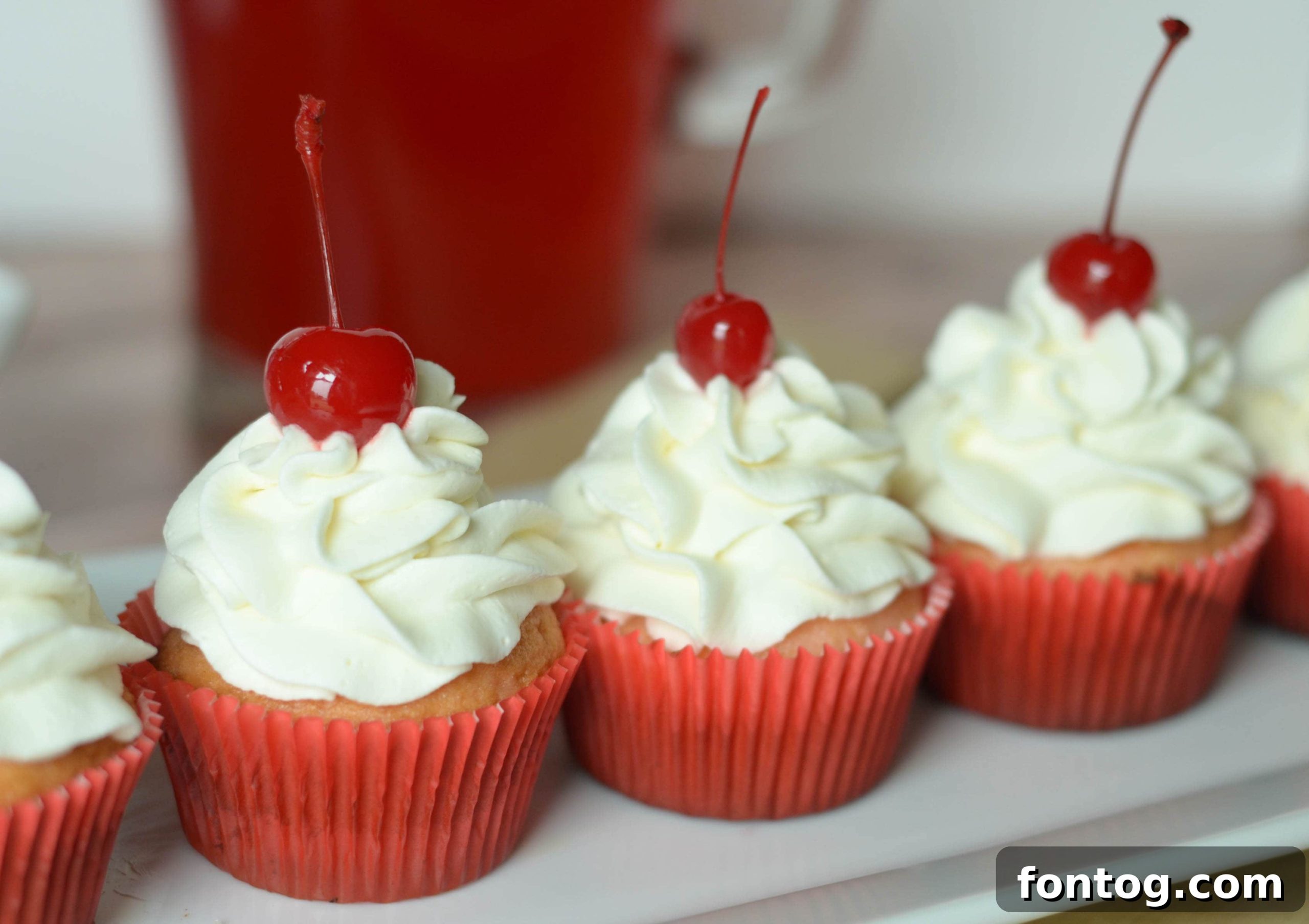 Cherry Kool-Aid Cupcake with whipped cream and cherry