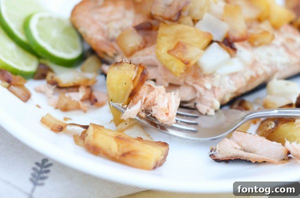 Vibrant Grilled Salmon with Tropical Pineapple Salsa 4 Warm pineapple salsa simmering in a pan, ready to be served over grilled salmon.