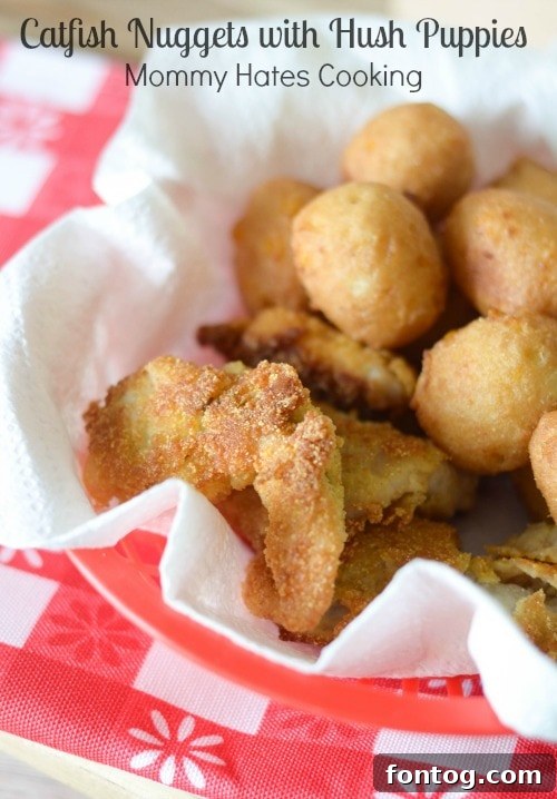 Golden-brown catfish nuggets and sweet corn hush puppies served in a red basket, ready for a Fourth of July picnic.