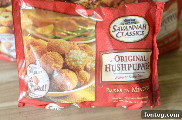 A vibrant display of catfish nuggets and sweet corn hush puppies in red paper baskets, ready for a family gathering.