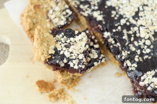 Peanut Butter and Berry Bliss Bars 5 Kids enjoying Peanut Butter & Berry Bars with a glass of milk
