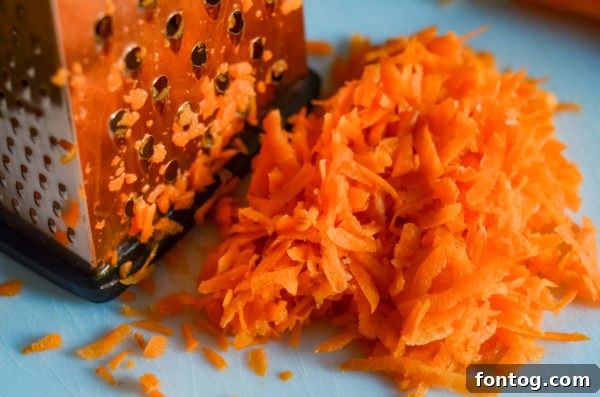 Finely shredded fresh carrots, essential for moist carrot cake cupcakes