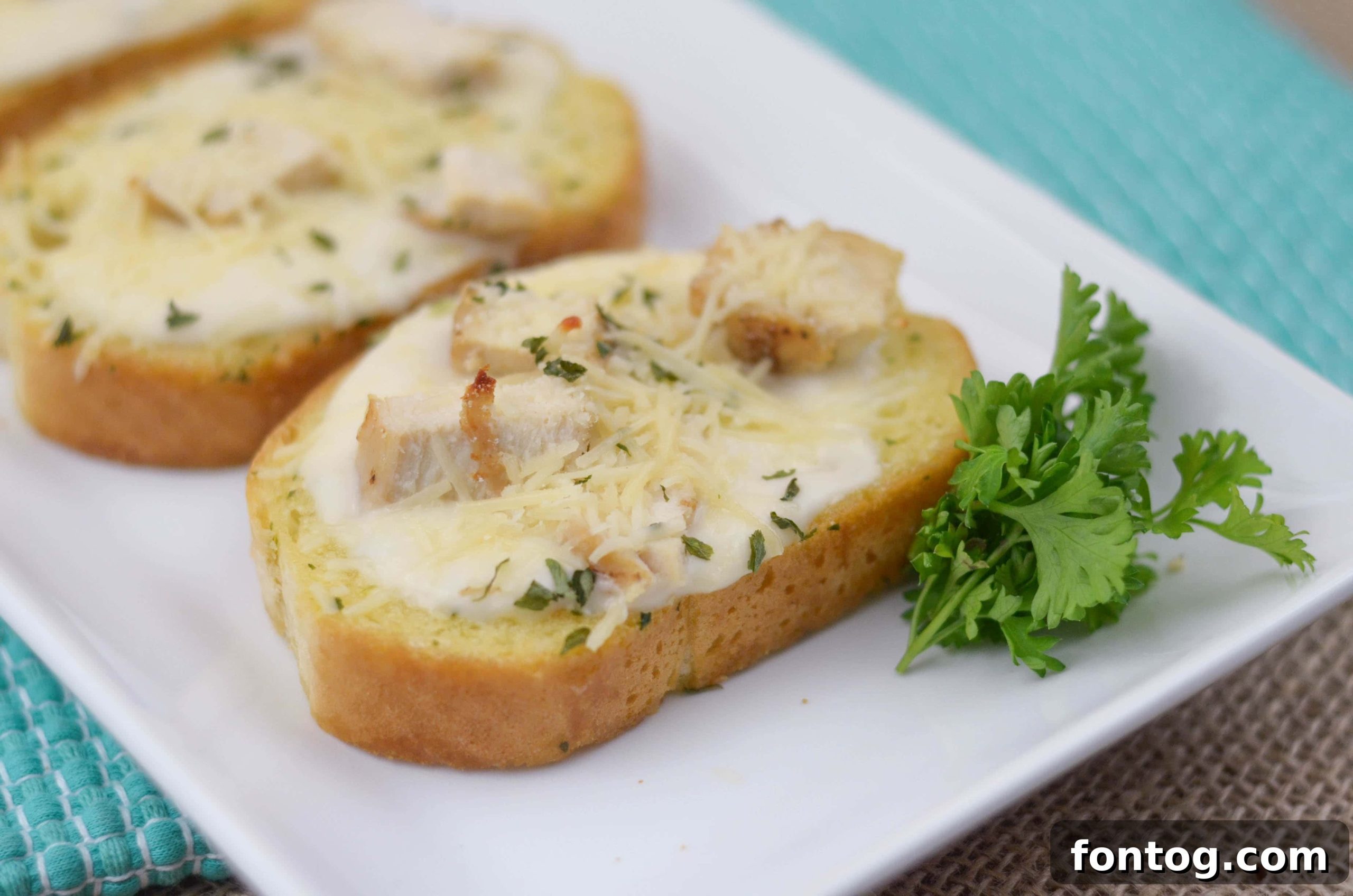 Delicious Chicken Alfredo Garlic Bread Pizzas ready to serve on a platter