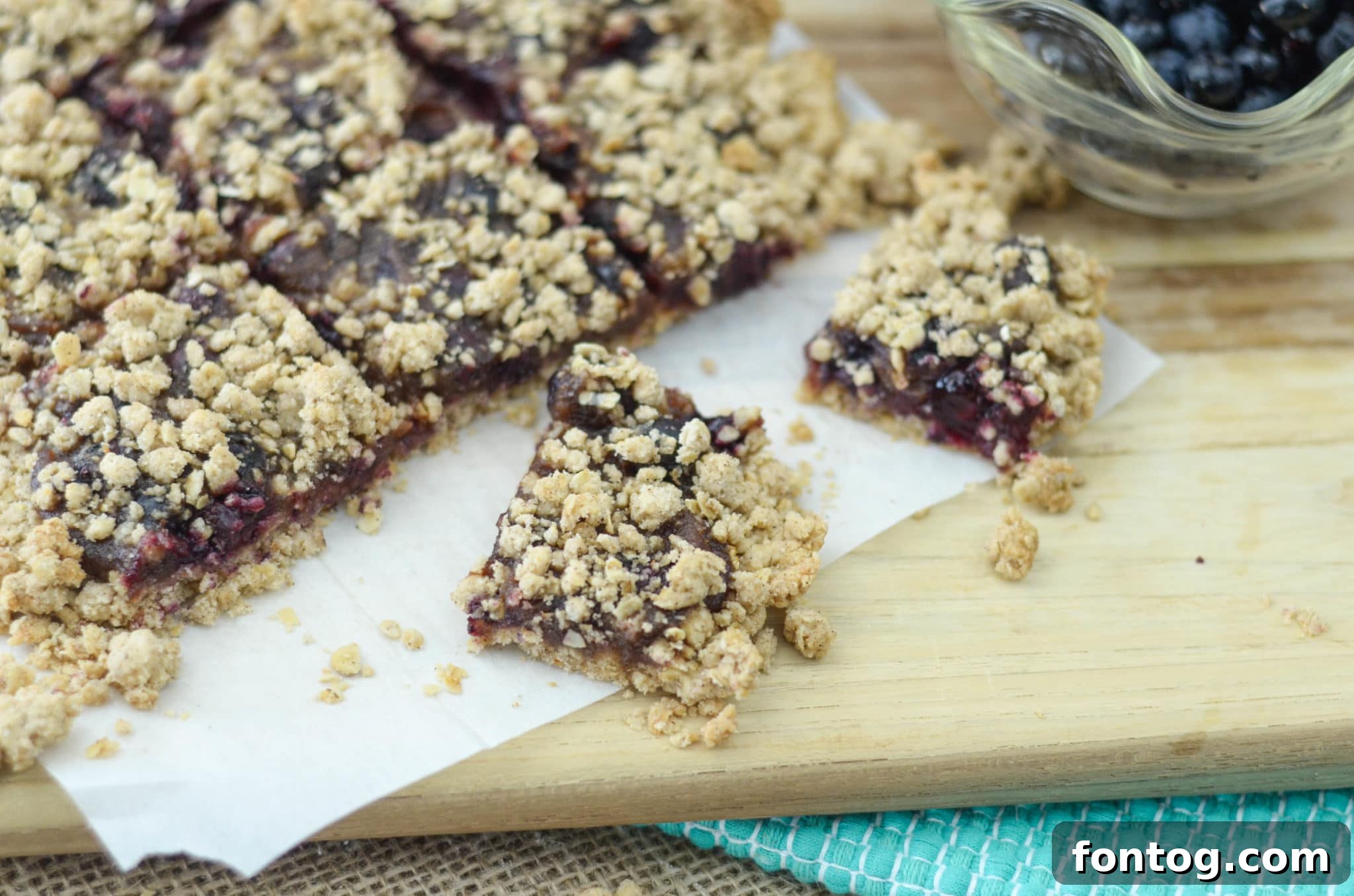 Freshly baked blueberry oatmeal breakfast bars, golden brown and inviting.