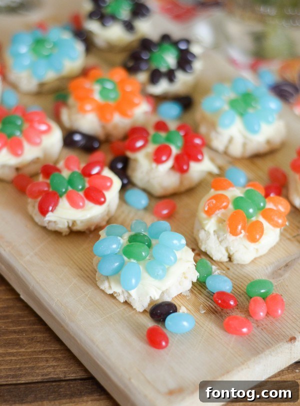 Overhead shot of Jelly Bean Flower Cookies on a white background, highlighting their simple yet effective floral patterns.