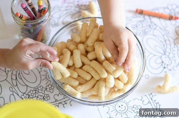 Children happily coloring and enjoying snacks together at a playdate.