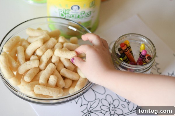 Gerber Lil' Beanies in a car seat, perfect for mess-free snacking on the go.